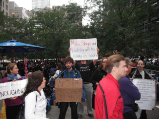 Illustration for article titled "Radiohead Wouldn't Play In The Big East Either": Occupy Wall Street Has An "Occupy Herbstreit" Photobomber